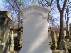 A clean white monument over the graves of nine members of the Lazard, Aron and Revel families